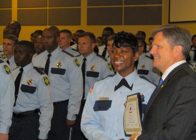 Prison Commissioner Jeff Dunn, right, with new correctional officer