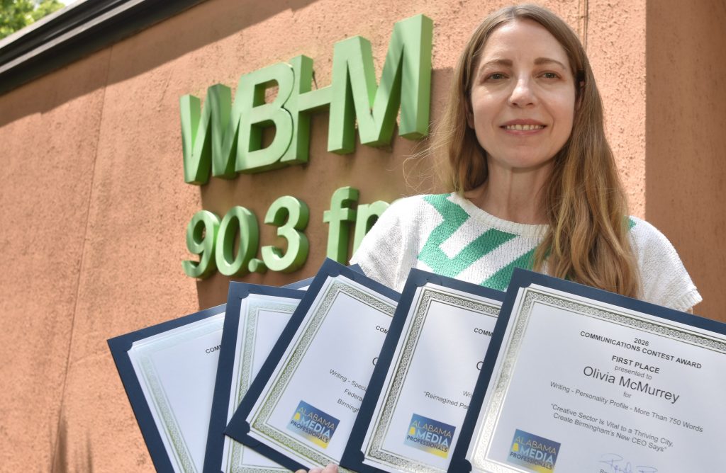 Olivia McMurrey displays some of the awards she earned in the 2026 Alabama Media Professionals Communications Contest.