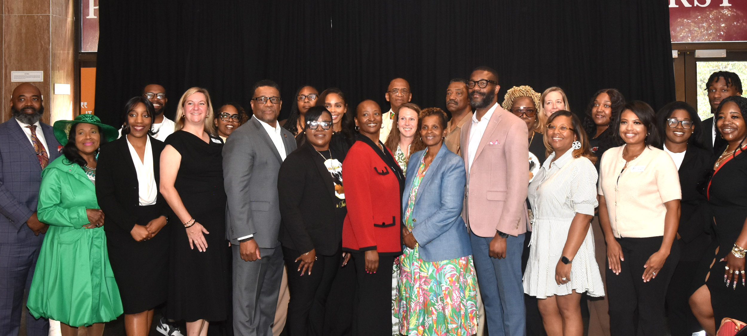 Birmingham Mayor Randall Woodfin poses with representatives of the 14 agencies receiving microgrants during a press conference on Apr. 27, 2026.