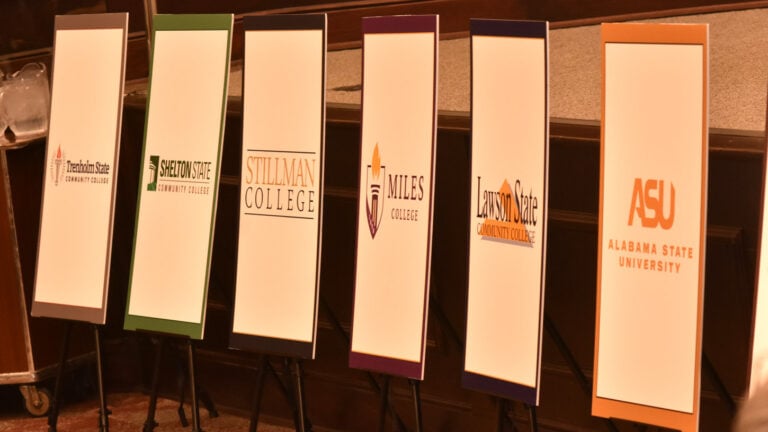 Narrow white banners representing six of the 14 HBCUs and HBCCs represented at Thursday's Birmingham Business Alliance HBCU breakfast on Oct. 29, 2026.